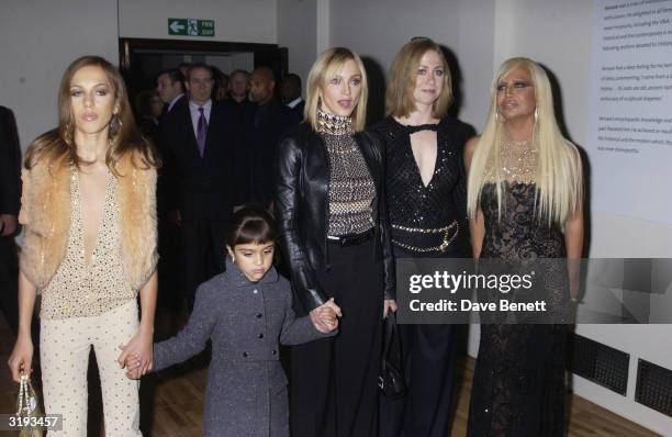 Allegra Versace , American singer Madonna with daughter, Lourdes, Chelsea Clinton, and Italian designer Donatella Versace attend the launch of the...