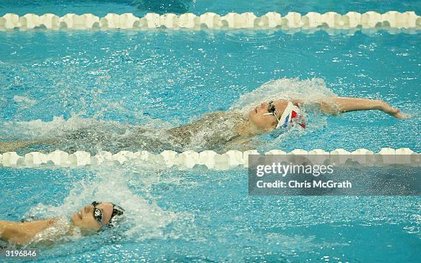 Melissa Morgan leads Frances Adcock in the Women's 200 metre backstroke final during finals on day seven of the 2004 Telstra Olympic Team Swimming...