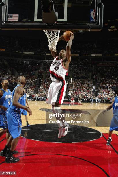 Theo Ratliff of the Portland Trail Blazers dunks the ball during the game against the Orlando Magic at the Rose Garden on March 20, 2004 in Portland,...