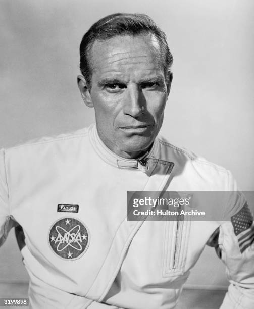 Promotional headshot portrait of American actor Charlton Heston in his astronaut costume for his role in director Franklin Schaffner's film, 'Planet...