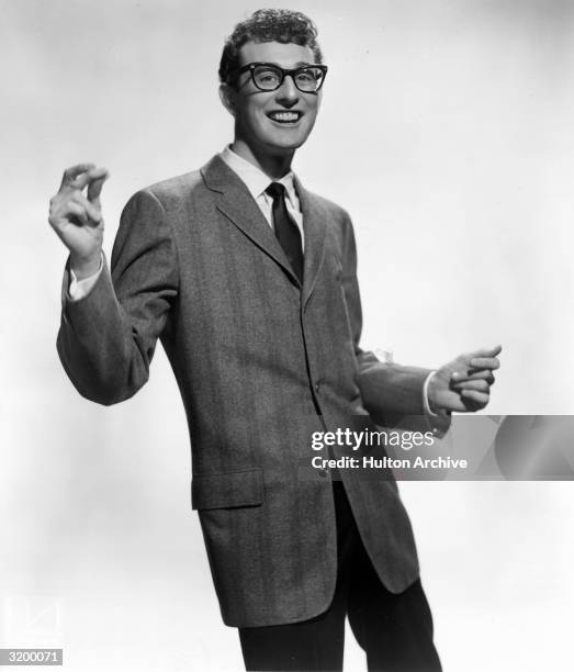 Rock-n-roll star Buddy Holly snapping his fingers.