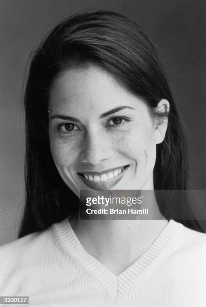 Headshot of actor Maxine Bahns wearing a v-neck sweater, summer 1997.