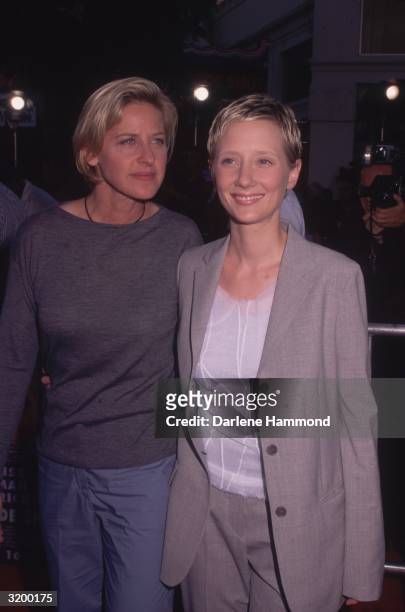 Ellen Degeneres and Anne Heche posing together at the premiere for the film Eyes Wide Shut, Mann's Village Theater, Los Angeles, California.