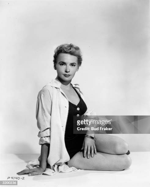 Portrait of British actor Elaine Aiken posing in a swimsuit and jacket.