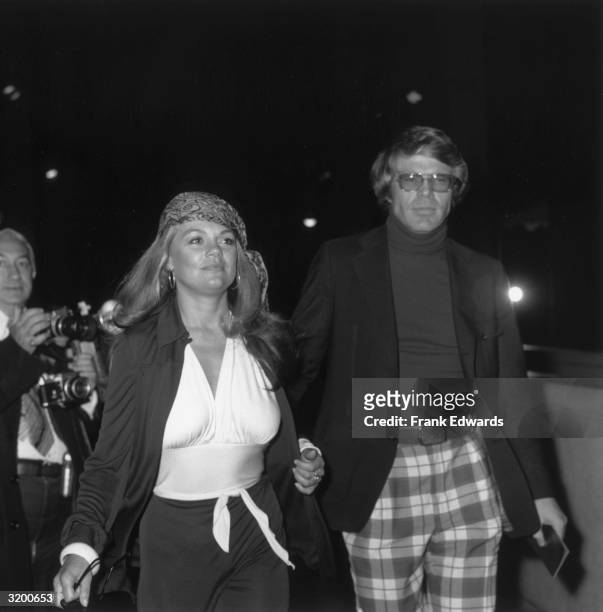 American actor Dyan Cannon and her date, Ron Travis, arrive at the premiere of director Mel Stuart's documentary film, 'Wattstax,' Hollywood,...