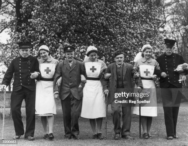 Chelsea Pensioners evacuated to the safety of the English countryside after their usual residence in London is bombed during the blitz. They are...