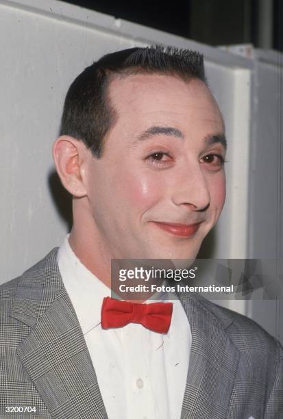 Headshot of Pee-wee Herman smiling.