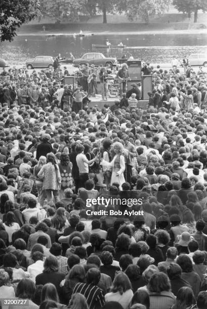 Crowd of young hippies watching British folk-rock group Jethro Tull at the first pop concert to be held in Hyde Park, London, on the banks of Lake...