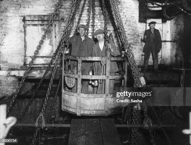 Using his newly developed Sashalight, photographer Sasha has taken this picture of coal miners in the emergency cage. The Sashalight is a new type of...