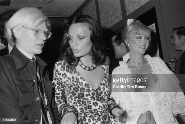 Left to right: Artist Andy Warhol , fashion designer Diane von Furstenberg, and actor Monique Van Vooren, star of Warhol's 'Flesh for Frankenstein,'...