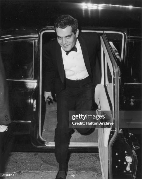 Egyptian actor Omar Sharif exiting a limousine at the premiere of British director David Lean's film, 'Doctor Zhivago,' in which Sharif starred, 1965.