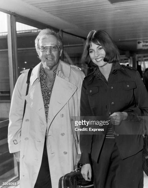 British actor and comedian Peter Sellers and his fiance, British actor Lynne Frederick, arrive at Heathrow Airport, London, England.