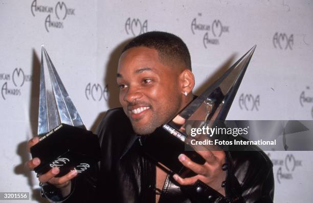 American actor and rap singer Will Smith at the American Music Awards displaying his two awards, one for 'Favorite Male Artist' and the other for...