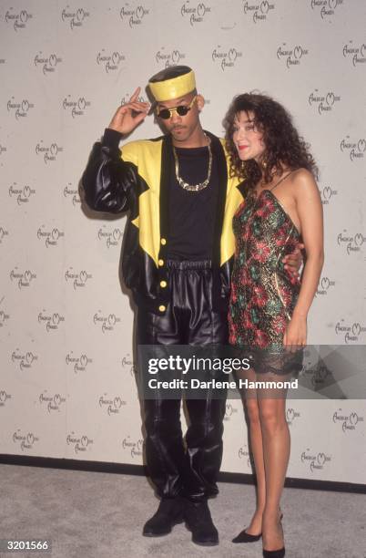 American rap singer Will Smith, a.k.a. The Fresh Prince, and Canadian pop singer Celine Dion hug at the American Music Awards. Smith wears a black...