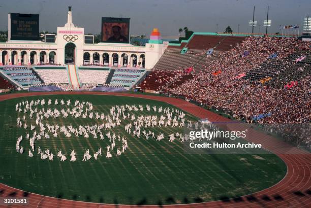 High-angle view of human Olympic ring formations at summer games, Olympic Stadium, Los Angeles, California.