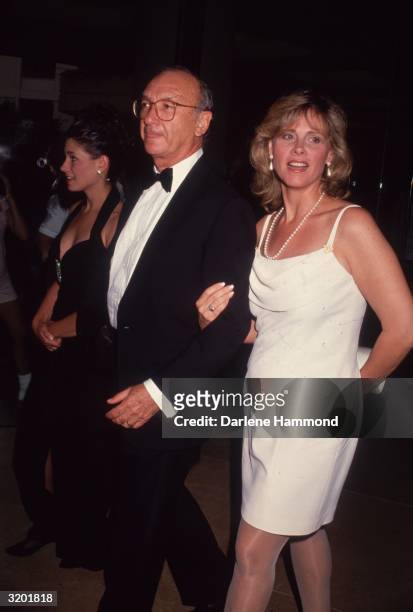 American playwright Neil Simon and wife Diane Lander in formal attire.