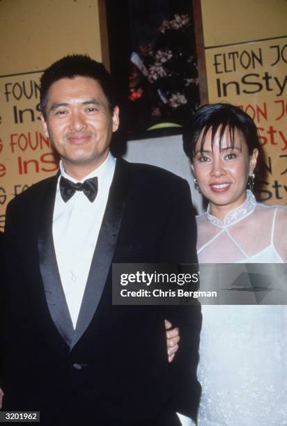 Hong Kong-born Chinese actor Chow Yun-Fat and his wife, Jasmine, pose together at the Elton John/'In Style' Oscar Night party, Beverly Hills,...