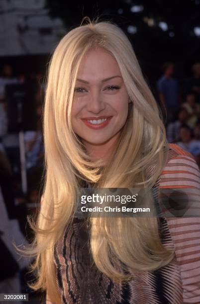 Headshot of Australian-born actor Portia de Rossi attending the premiere of director John Woo's film, 'Mission Impossible 2', Hollywood, California.