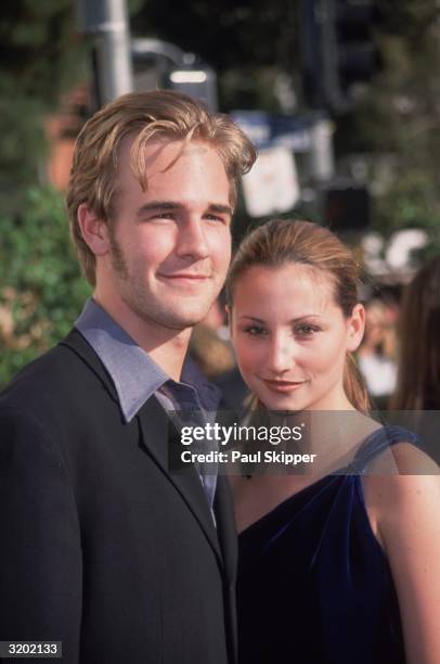 American actors James Van Der Beek and Heather McComb smiling outdoors at the 6th Annual Blockbuster Entertainment Awards, Shrine Auditorium, Los...