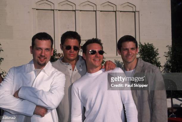 American pop singing group 98 Degrees smiling outdoors at the 6th Annual Blockbuster Entertainment Awards, Los Angeles, California. The group was...
