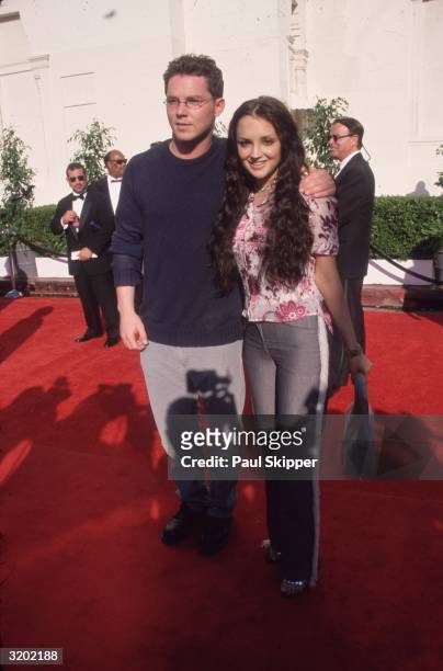 Full-length view of American actor Rachael Leigh Cook and Shawn Hatosy smiling while standing on a red carpet at the 6th Annual Blockbuster...