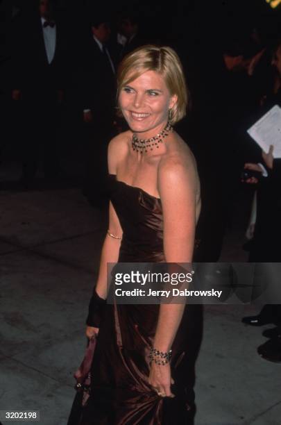 American actor Mariel Hemingway wears a strapless copper gown and a three-tiered choker at the 'Vanity Fair' Oscar Party, Morton's restaurant,...