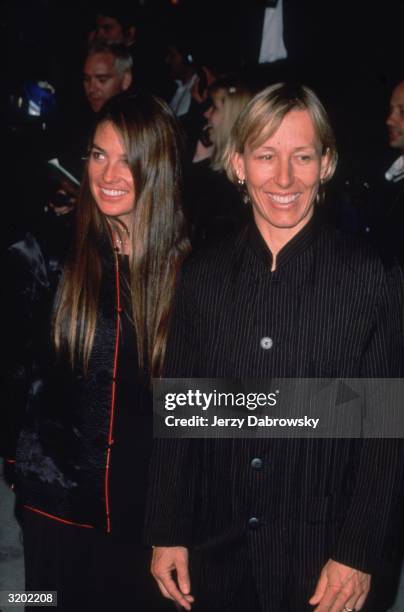 Czech-born tennis player Martina Navratilova and her date smile while posing at the 'Vanity Fair' Oscar Party, Morton's restaurant, Beverly Hills,...