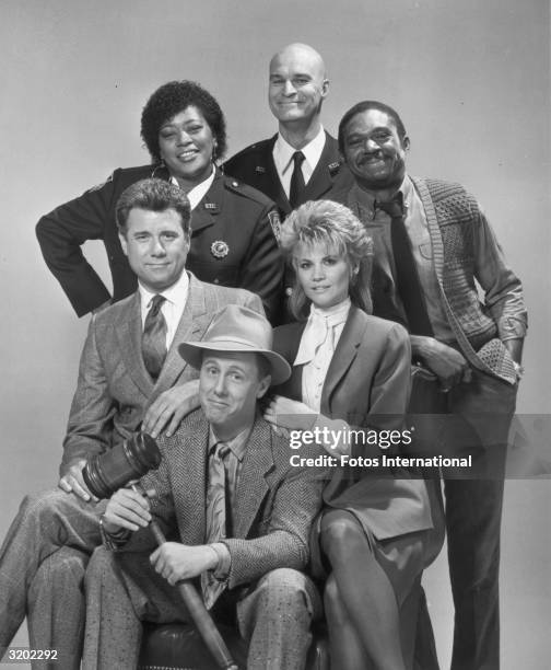 Studio portrait of the cast of the television show, 'Night Court'. L-R clockwise from center: Harry Anderson , John Larroquette, Marsha Warfield,...