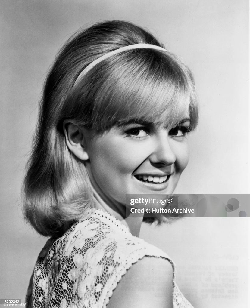 Headshot of American actor Shelley Fabares smiling while looking over