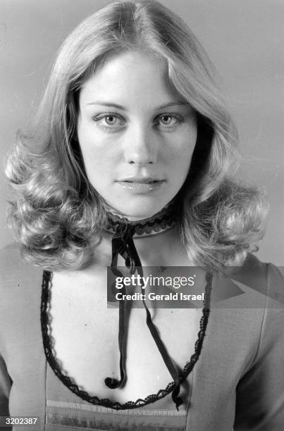 Studio headshot portrait of American model and actor Cybill Shepherd wearing a scoop-necked top with a matching choker, New York City.