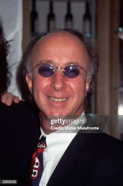 Headshot of Canadian-born musician and bandleader Paul Shaffer, of 'The Late Show with David Letterman,' wearing sunglasses with purple lenses, a...