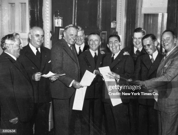 Senate passage of Bonus Bill. L-R: Sen. Pat McCarran, National Commander of the American Legion, Ray Murphy, Sen. Frederick Steiwer, National...