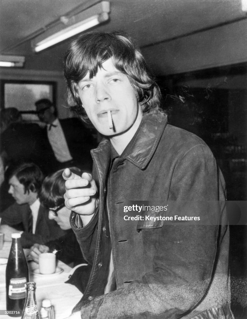 Mick Jagger, the lead singer of the Rolling Stones, smoking a... News