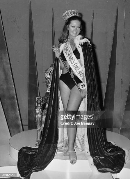 Playboy Bunny Girl Myra van Heck wearing her Miss England sash and crown after Angela Turner was mistakenly named as the winner.