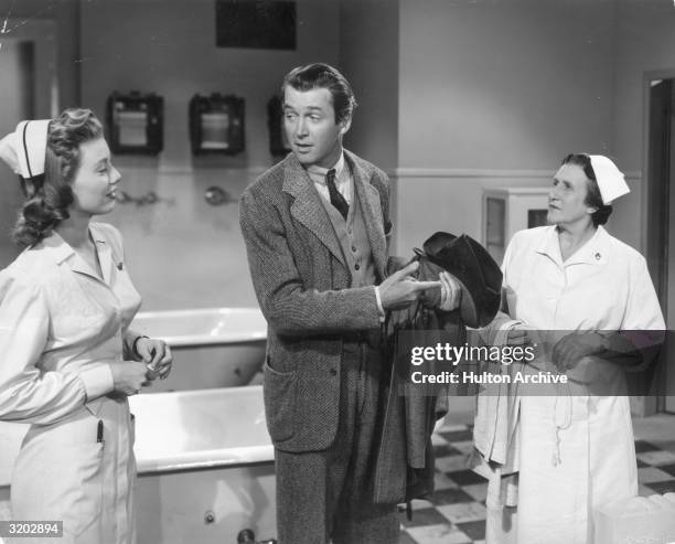 Movie still of American actors James Stewart and Peggy Dow in the therapeutic bathing room, in a still from director Henry Koster's film, 'Harvey'....