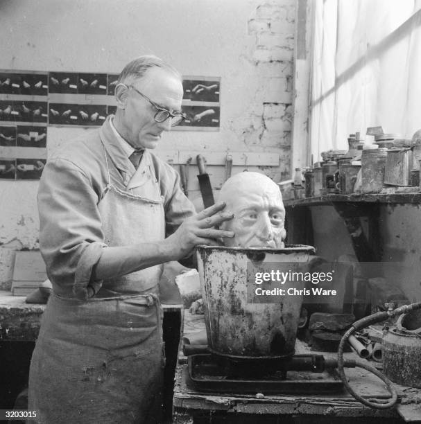 Wax caster, Alec Williams making a model of Ivan The Terrible's head at Gem's Ltd, in the Portobello Road area of west London. The company makes...