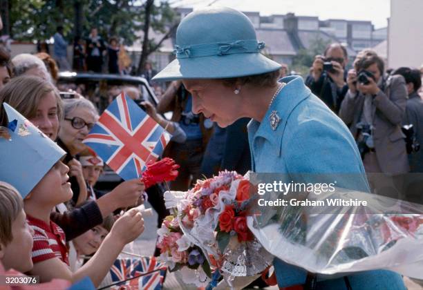 Queen Elizabeth II talking to well wishers in Camberwell during her silver jubilee year celebrations.