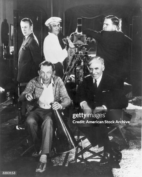 Film directors Alf Goulding, Del Lord, Eddie Cline, Canadian-born film producer Mack Sennett and director Larry Simon pose around a motion-picture...