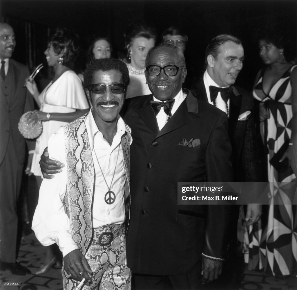 American entertainer Sammy Davis, Jr. standing with his father,... News