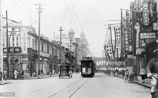 Looking down Shanghai's Nanking Road. The area was decimated two days later after the first bomb of Japan's raids on China landed here.