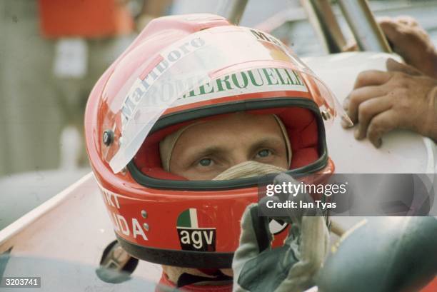 Austrian racing driver Niki Lauda gestures he is pleased with his car before the British Grand Prix at Brands Hatch.