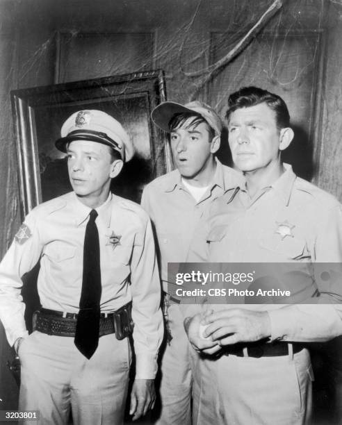 American actors Don Knotts Jim Nabors and Andy Griffith look perplexed in a haunted house, in a still from the television series, 'The Andy Griffith...