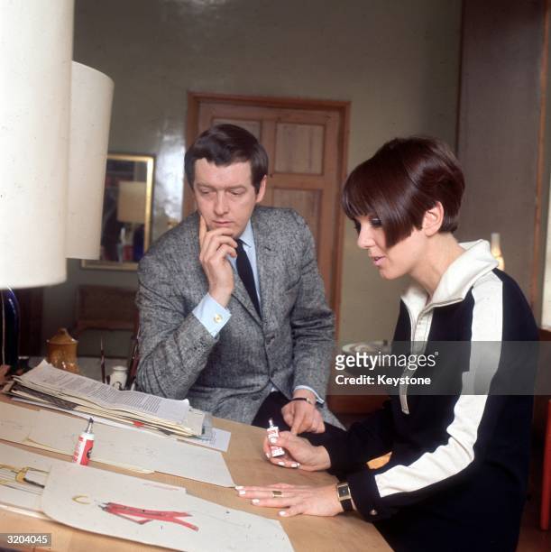 Dress designer Mary Quant at her desk with her husband Alexander Plunkett Greene at their home.