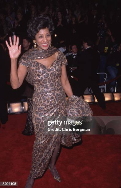 Full-length image of American actor Marla Gibbs waving to crowds at the American Comedy Awards, Shrine Exposition Center, Los Angeles, California....
