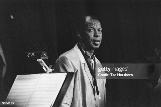 American alto saxophonist Ornette Coleman perspires heavily while standing behind a music stand during the JVC Jazz Festival, Carnegie Hall, New York...