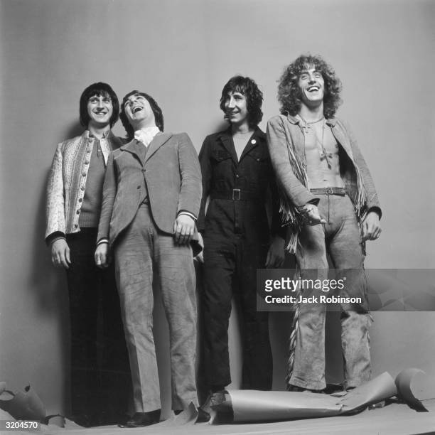 Bassist John Entwistle , drummer Keith Moon , guitarist Pete Townshend and singer Roger Daltrey of the British rock group The Who pose, smiling, for...