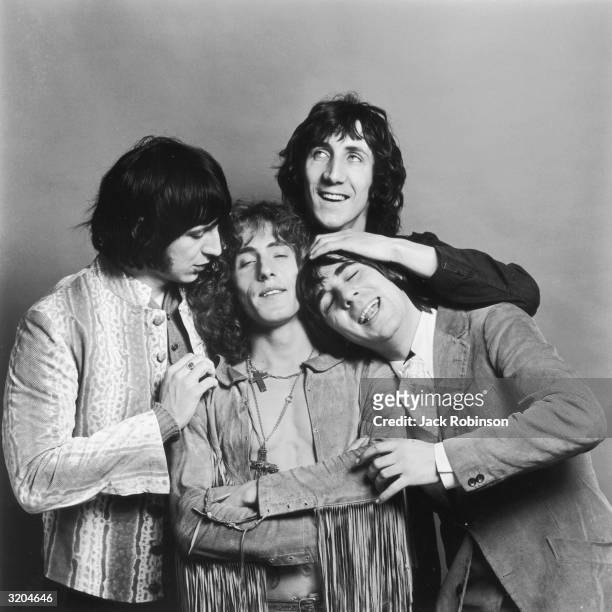 Bassist John Entwistle , singer Roger Daltrey, guitarist Pete Townshend, and drummer Keith Moon of the British rock band The Who pose in a cluster...