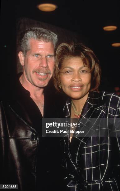 American actor Ron Perlman and his wife, fashion designer Opal S. Stone, smile while embracing at the premiere of director Carlos Avila's film, 'What...