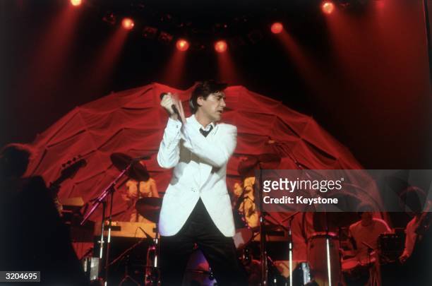 The lead singer of Roxy Music, Bryan Ferry, performing with the band at Wembley Arena.