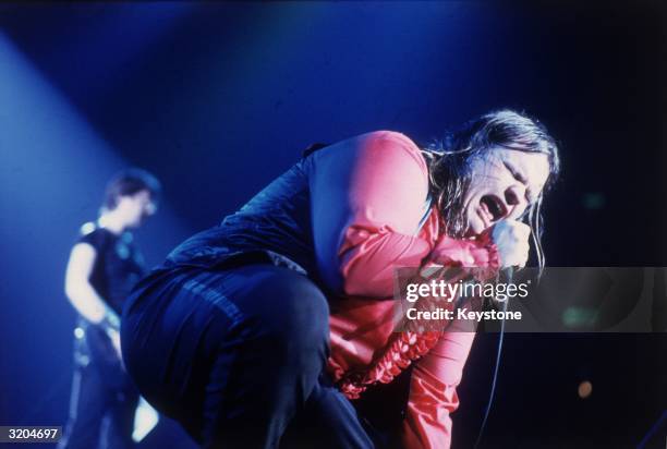 American rock star Meatloaf, real name Marvin Lee Aday, screams into the microphone like a bat out of hell, during a live concert.